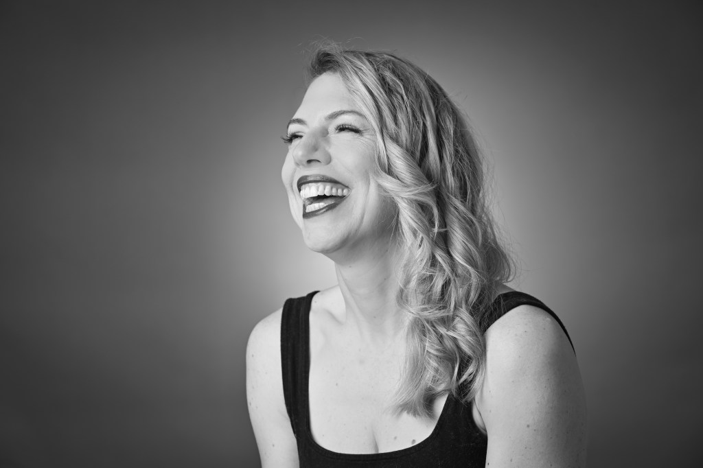 Cassandra Palo, owner and teacher at NICE Pilates, laughing